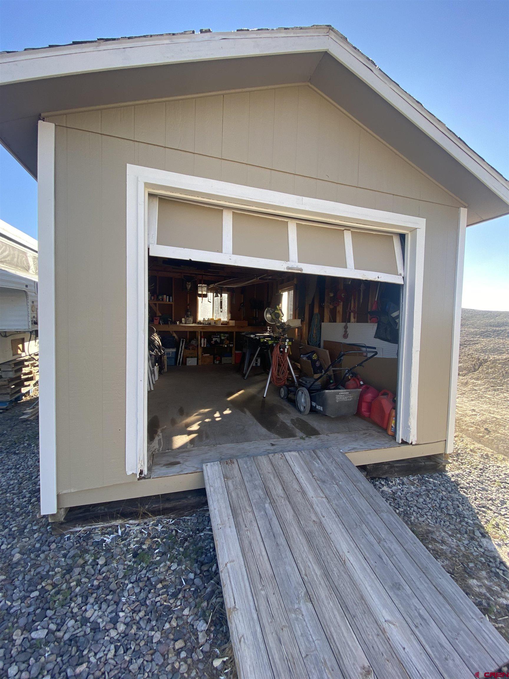 7156 Peach Valley Road Delta, CO 81416 - Photo 4 of 33 a view of a livingroom with wooden floor and a couch