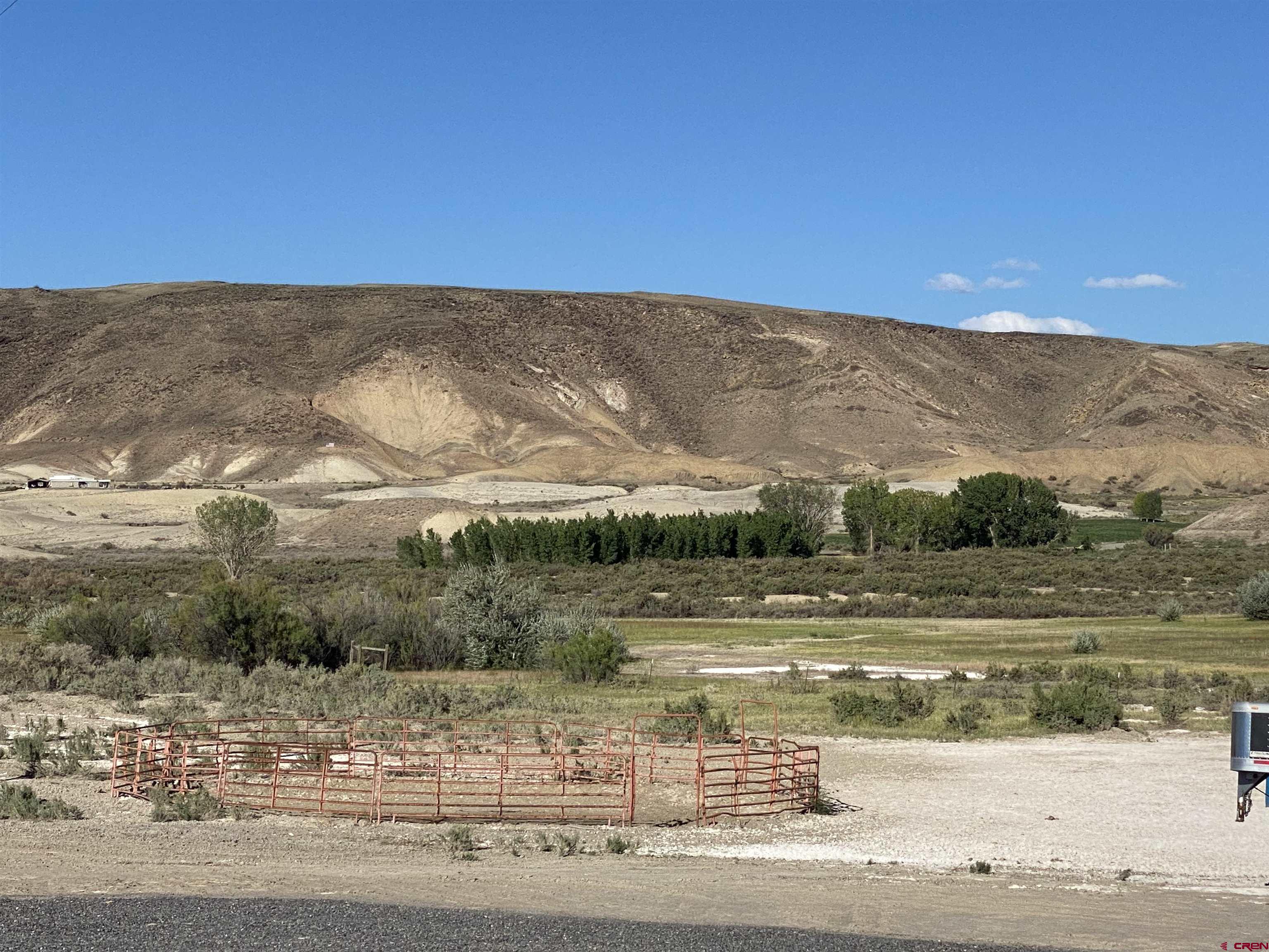 7156 Peach Valley Road Delta, CO 81416 - Photo 10 of 33 a view of a town with mountains in the background