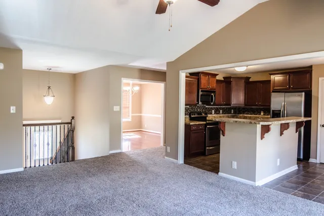 a kitchen with a stove and a microwave