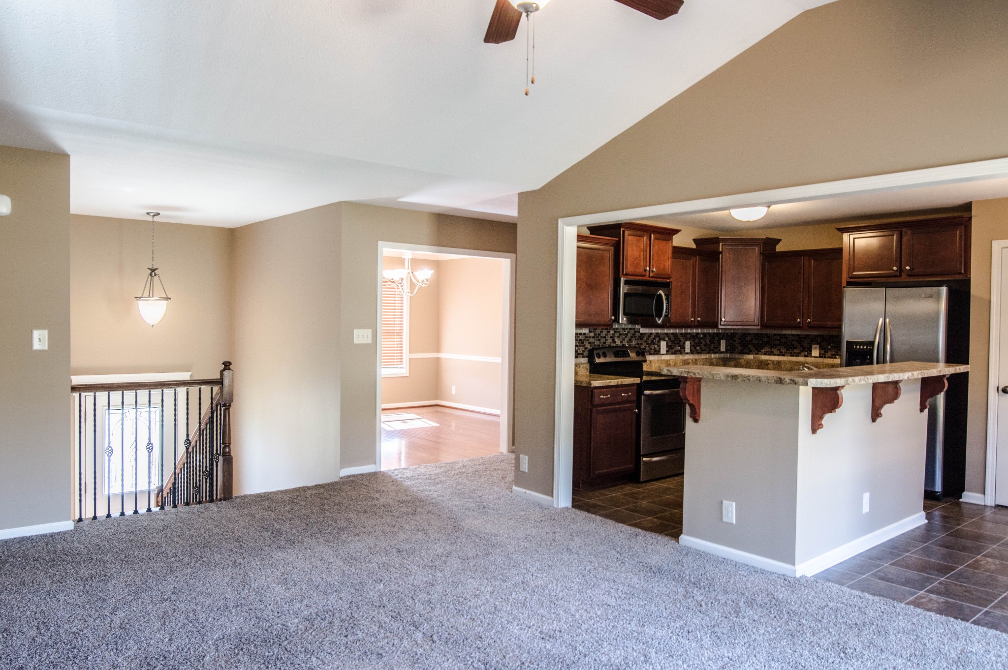 1005 Ishee Drive Clarksville, TN 37042 - Photo 4 of 20 a view of kitchen with stainless steel appliances kitchen island granite countertop a stove and a refrigerator