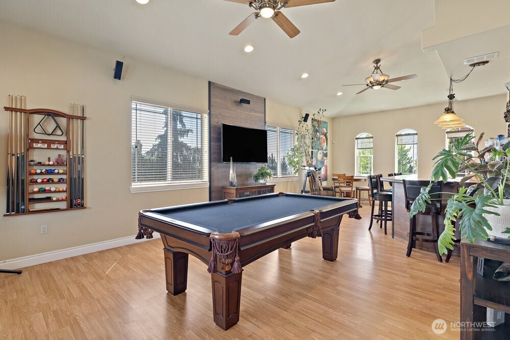 500 St Hilaire Road Yakima, WA 98901 - Photo 8 of 31 a room with furniture pool table flat screen tv and a chandelier