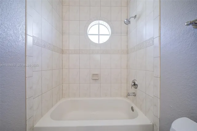 a close view of a bathtub in bathroom