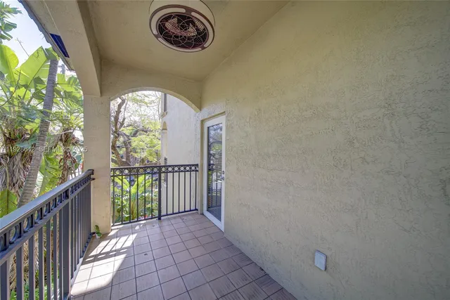 a view of a hallway with windows