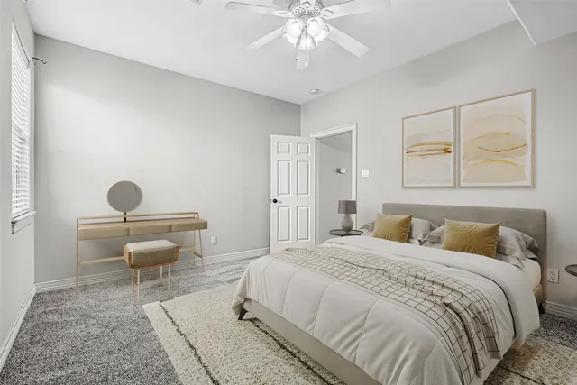 a bedroom with bed and a window