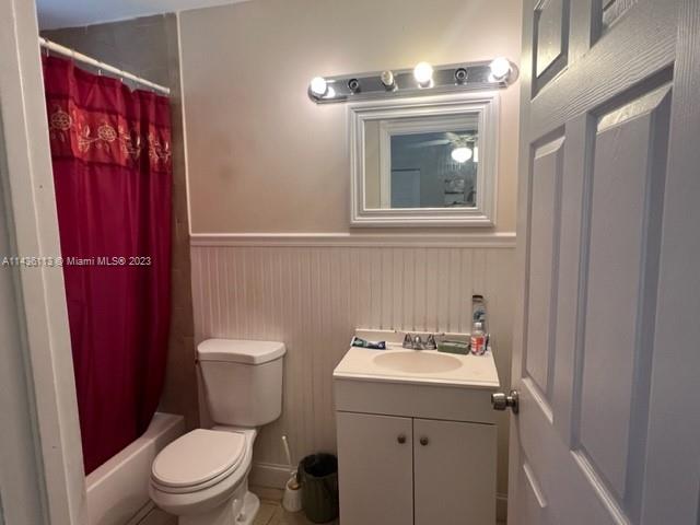 Goulds Miami, FL 33170 - Photo 12 of 18 a bathroom with a toilet a sink and mirror