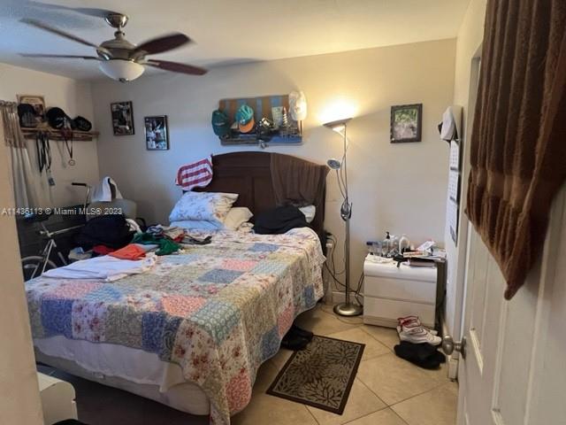 Goulds Miami, FL 33170 - Photo 14 of 18 a bedroom with a bed and a tv on the wall