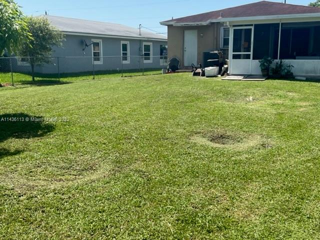 Goulds Miami, FL 33170 - Photo 3 of 18 a front view of a house with garden