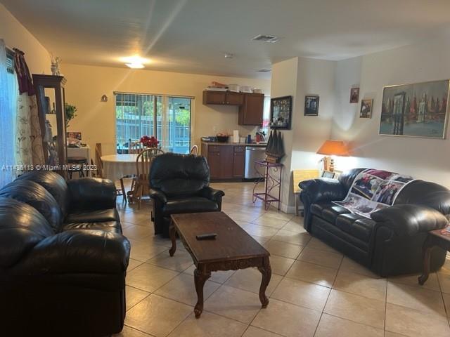 Goulds Miami, FL 33170 - Photo 7 of 18 a living room with furniture and a large window