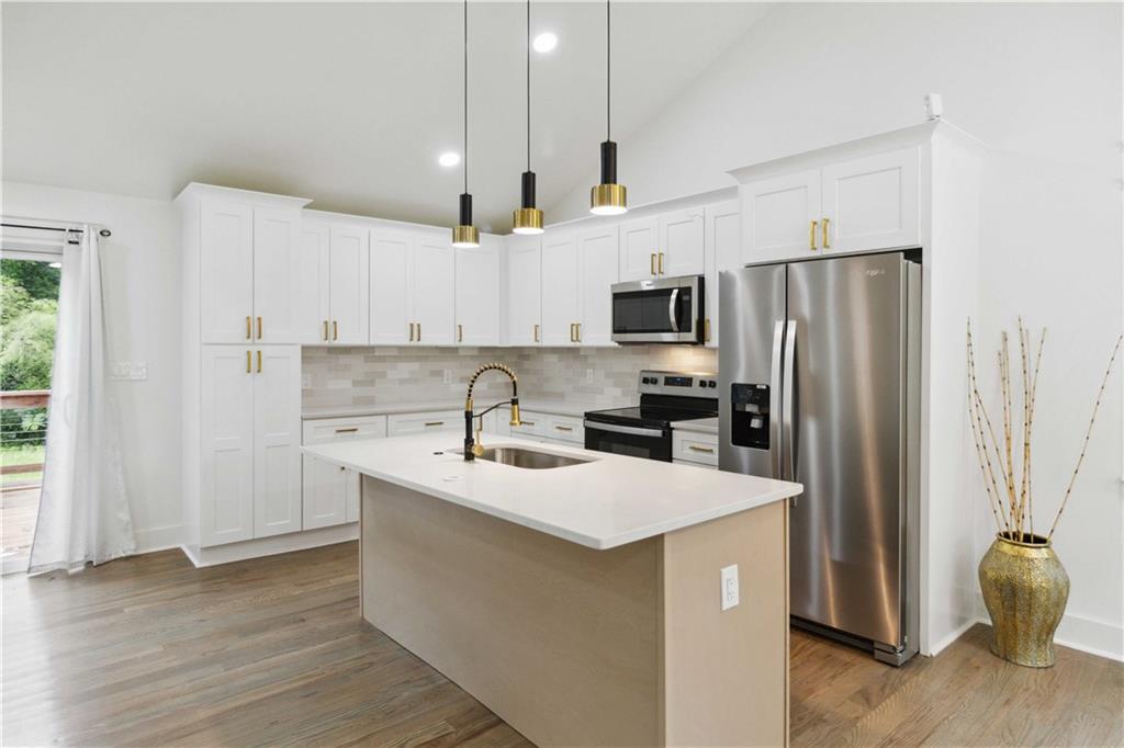 3435 Maplehurst Drive Decatur, GA 30032 - Photo 12 of 39 a kitchen with stainless steel appliances a refrigerator sink and microwave