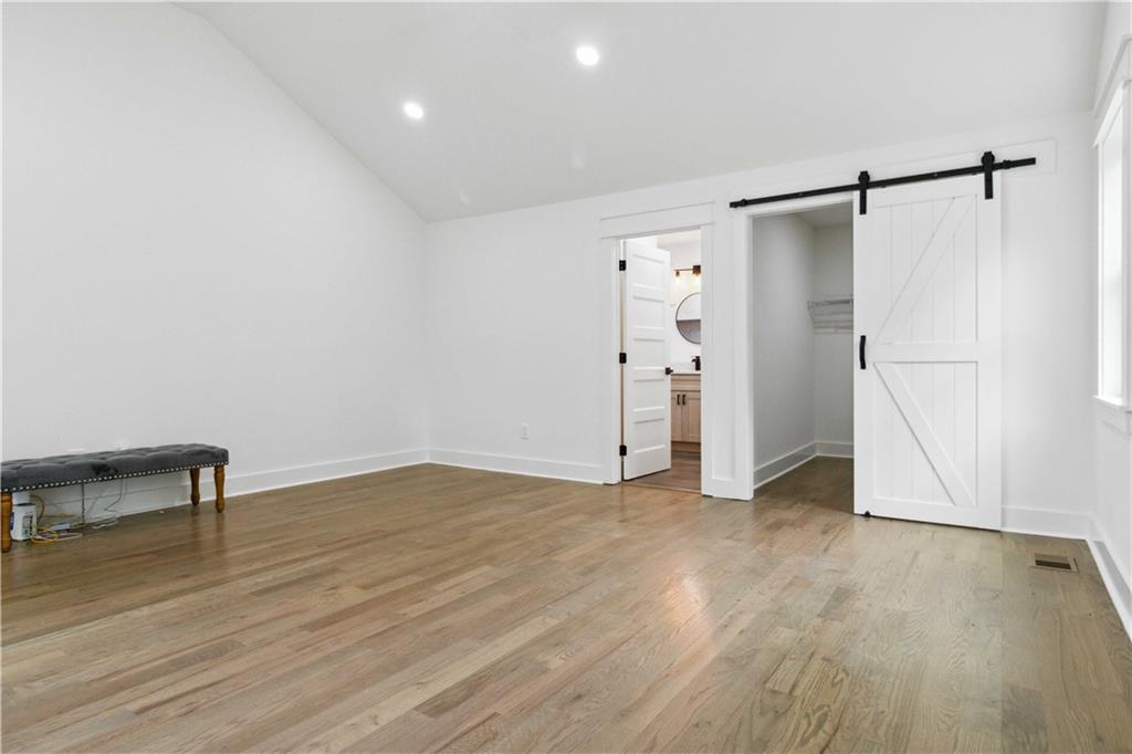 3435 Maplehurst Drive Decatur, GA 30032 - Photo 19 of 39 a view of empty room with wooden floor and fan