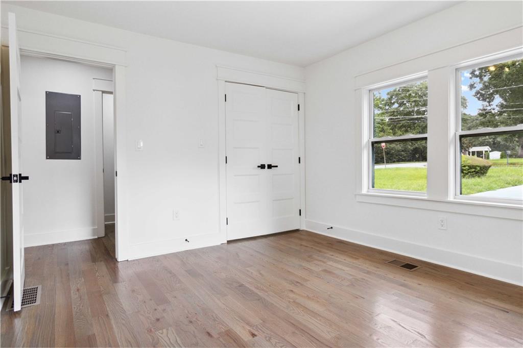 3435 Maplehurst Drive Decatur, GA 30032 - Photo 27 of 39 an empty room with wooden floor and windows