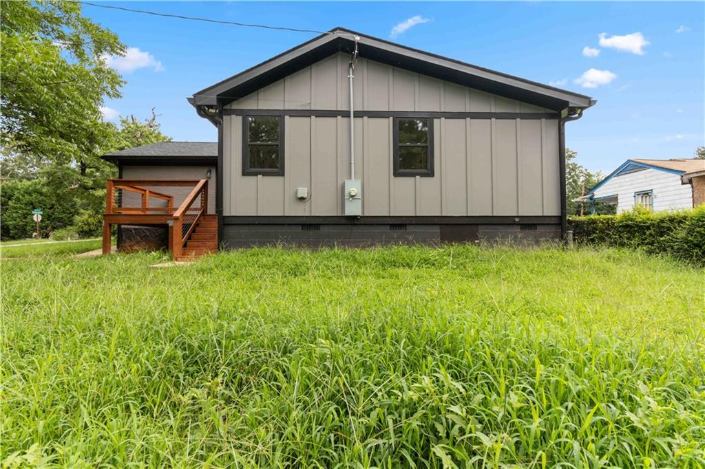 3435 Maplehurst Drive Decatur, GA 30032 - Photo 29 of 39 a backyard of a house with table and chairs