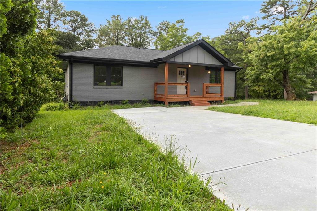 3435 Maplehurst Drive Decatur, GA 30032 - Photo 38 of 39 a front view of a house with a garden