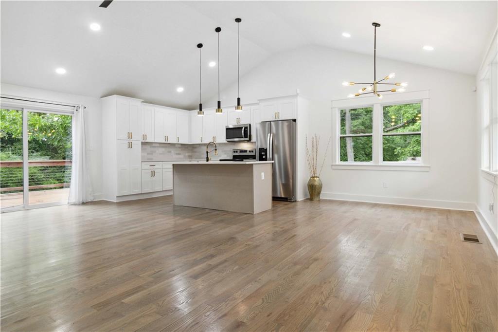 3435 Maplehurst Drive Decatur, GA 30032 - Photo 5 of 39 a view of a kitchen with a stove cabinets and a floor to ceiling window