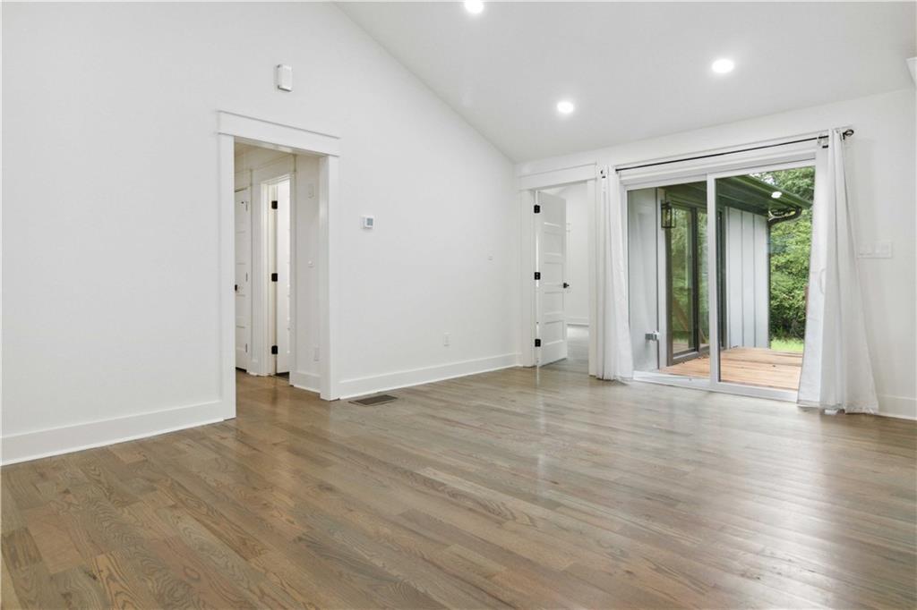 3435 Maplehurst Drive Decatur, GA 30032 - Photo 7 of 39 an empty room with wooden floor and windows