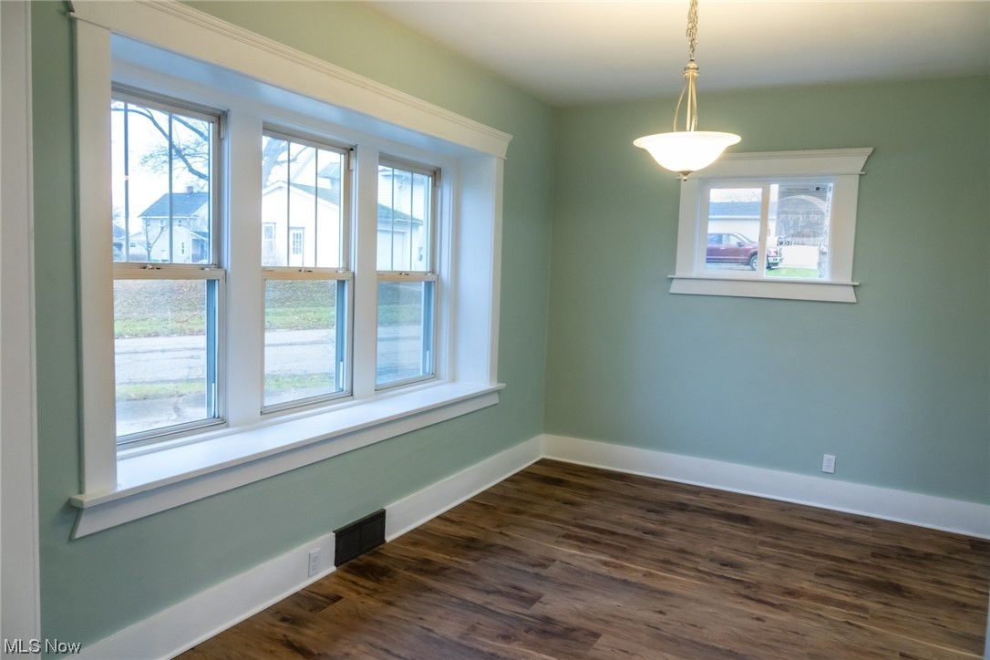 15 South 2nd Street Rittman, OH 44270 - Photo 9 of 24 Unfurnished room with plenty of natural light and dark hardwood / wood-style floors