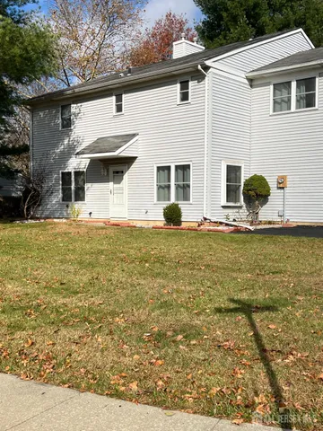 a view of a house with backyard