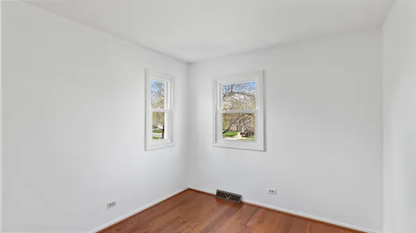 a view of room with window and furniture
