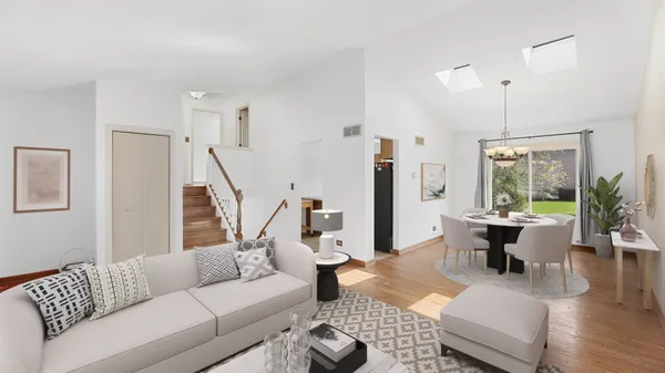 a living room with furniture or couch and a chandelier