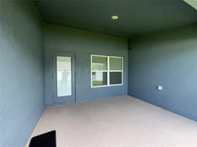 a view of an empty room with stairs