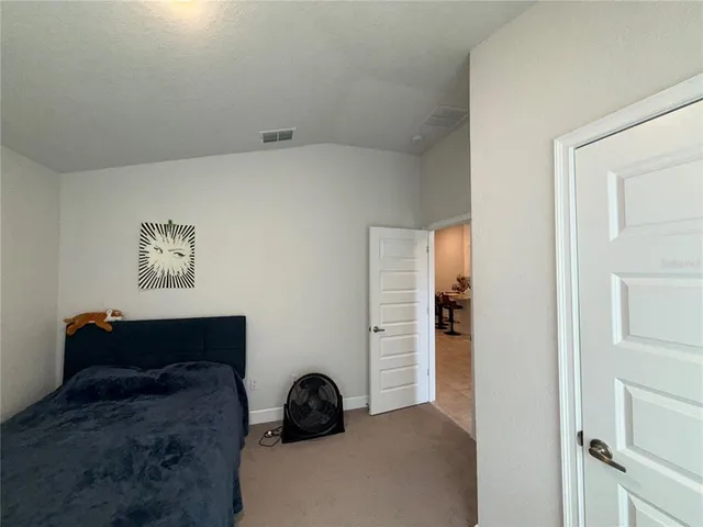 a view of bathroom with a toilet and a vanity