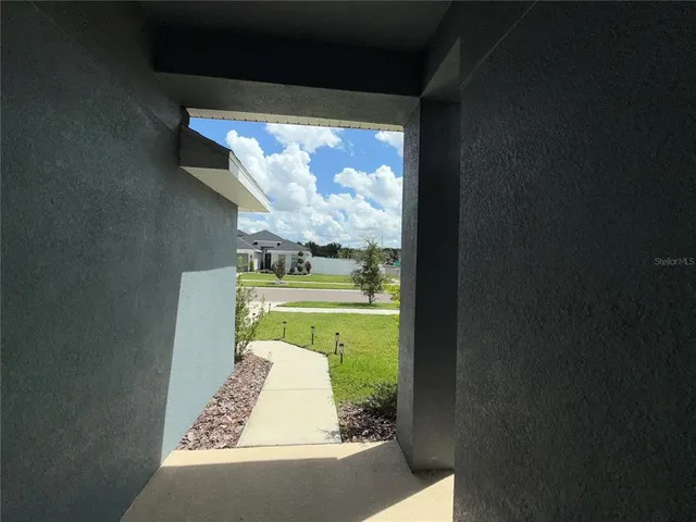 a front view of house with yard and trees