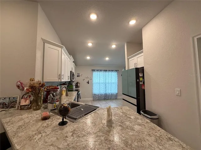 a kitchen with a sink and cabinets