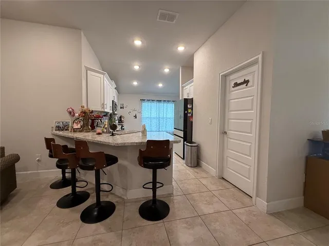 a kitchen with a stove top oven sink and cabinets