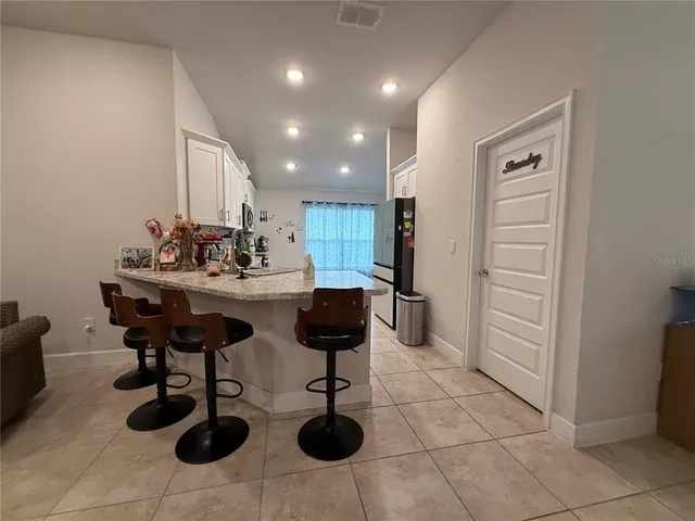 a kitchen with stainless steel appliances granite countertop a sink and cabinets