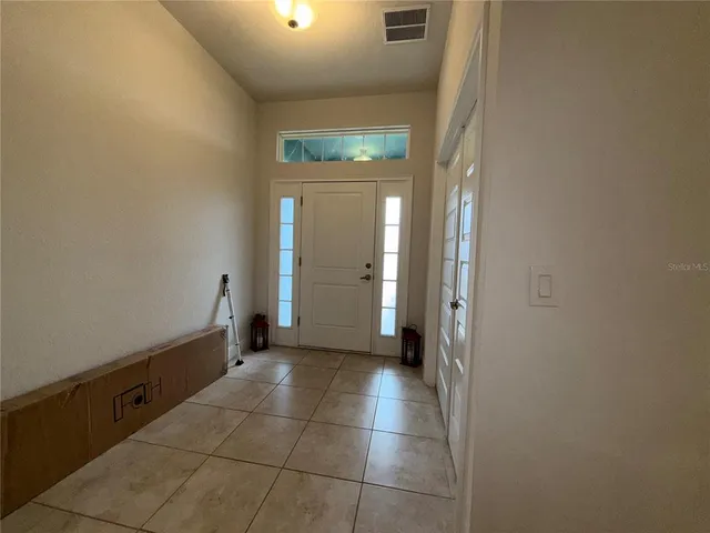 a view of a bathroom with a sink and a mirror