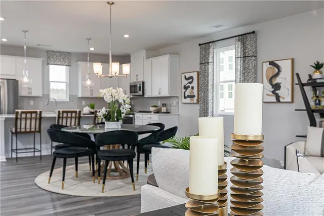 a view of a dining room with furniture and wooden floor