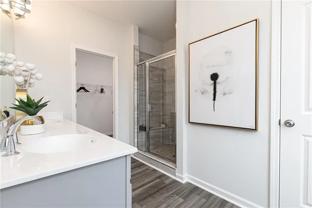 a bathroom with a shower and a sink