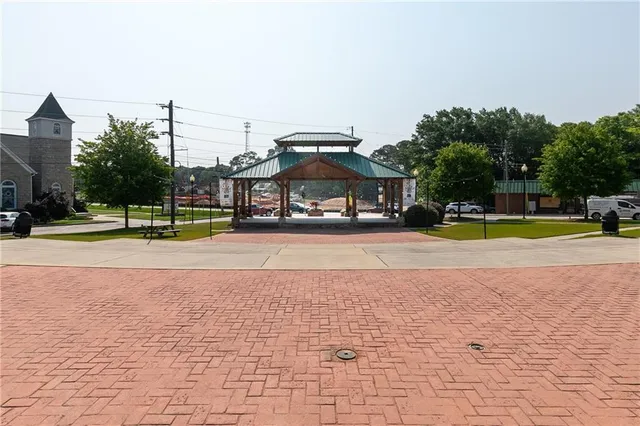 a view of a park with large trees