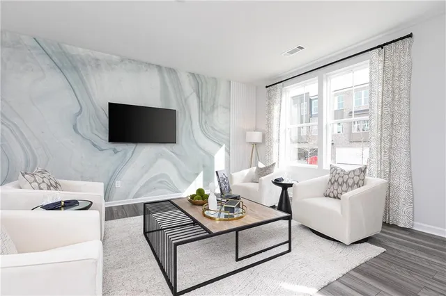 a living room with furniture and a flat screen tv