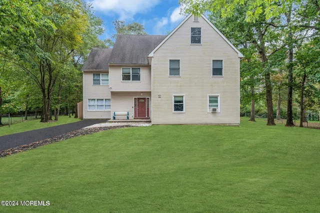 a view of a backyard of the house