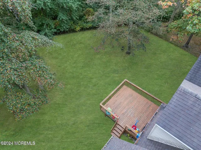 a view of a two chairs next to a yard