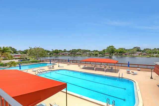 a front view of house with yard and outdoor seating