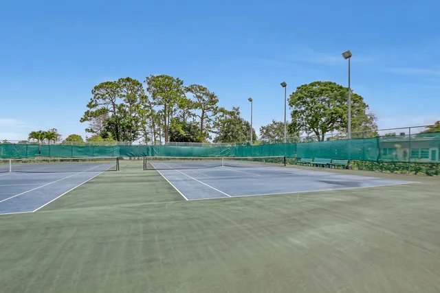 a couple of chairs that are sitting in the middle of a yard