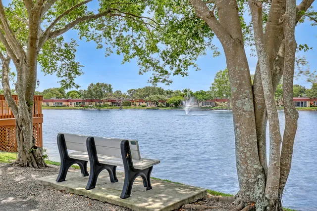 a view of a backyard with swimming pool