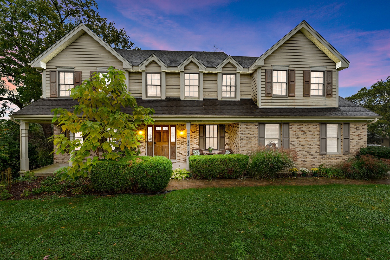27W223 Jewell Road Winfield, IL 60190 - Photo 2 of 23 a front view of a house with garden