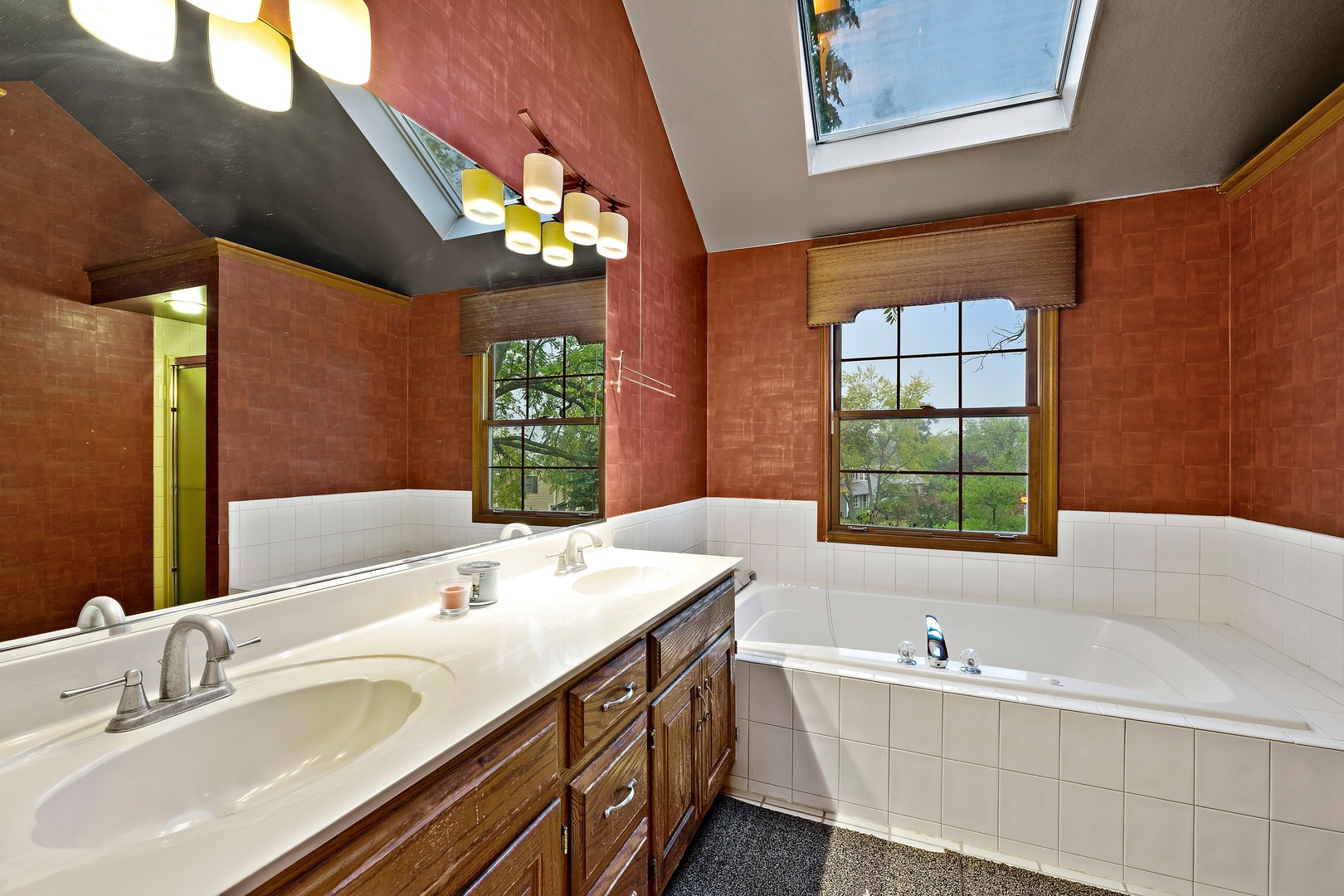 27W223 Jewell Road Winfield, IL 60190 - Photo 15 of 23 a spacious bathroom with a double vanity sink a large mirror and a bathtub