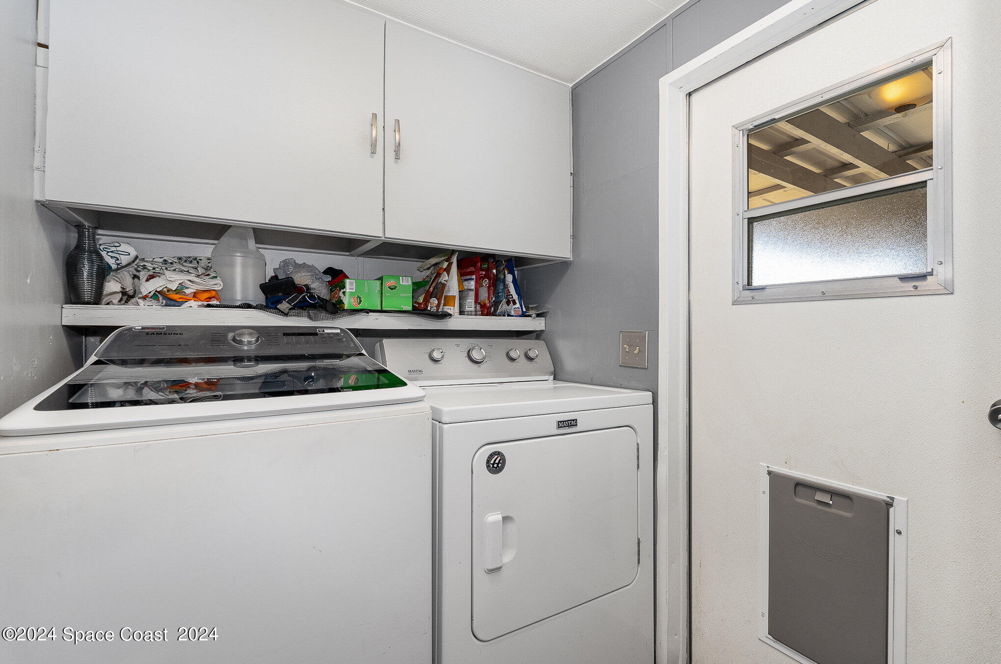 385 Ronald Street Cocoa, FL 32927 - Photo 16 of 24 a utility room with dryer and washer