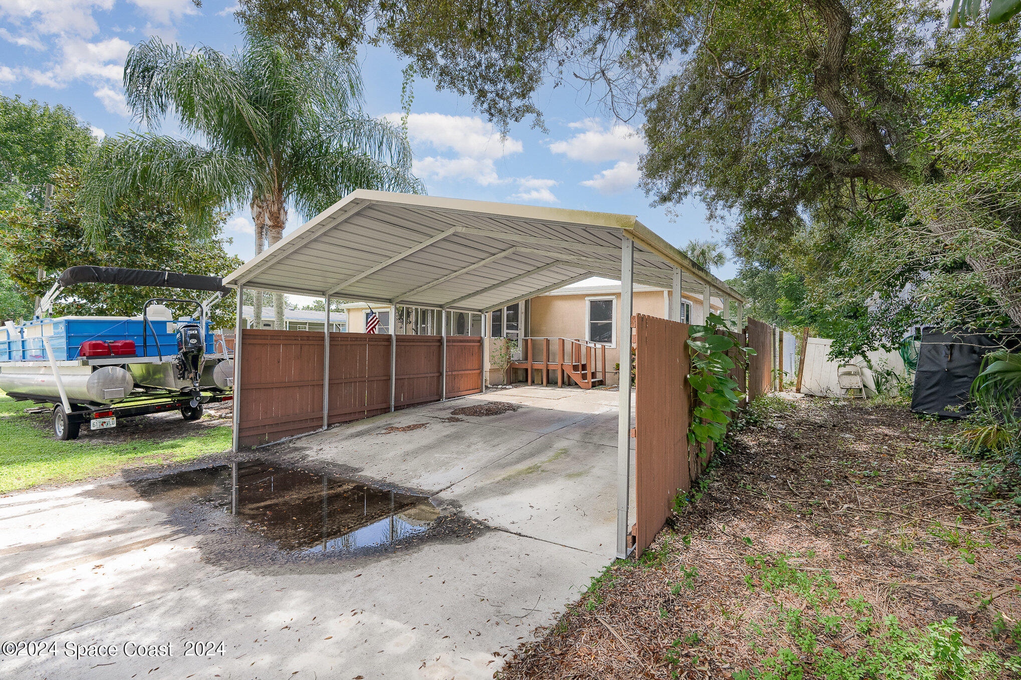 385 Ronald Street Cocoa, FL 32927 - Photo 18 of 24 a view of house with outdoor space and car parked