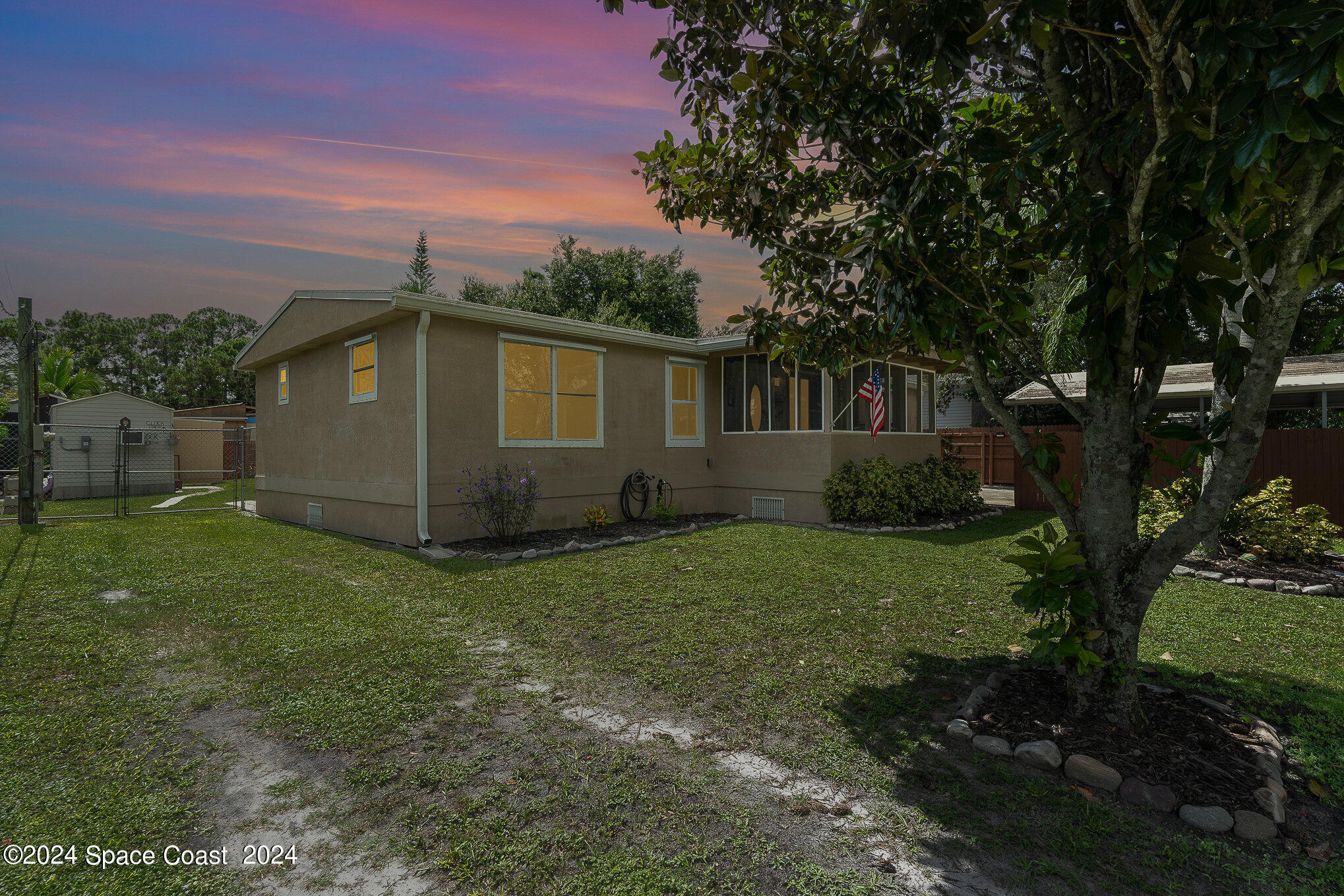 385 Ronald Street Cocoa, FL 32927 - Photo 19 of 24 a backyard of a house with lots of green space