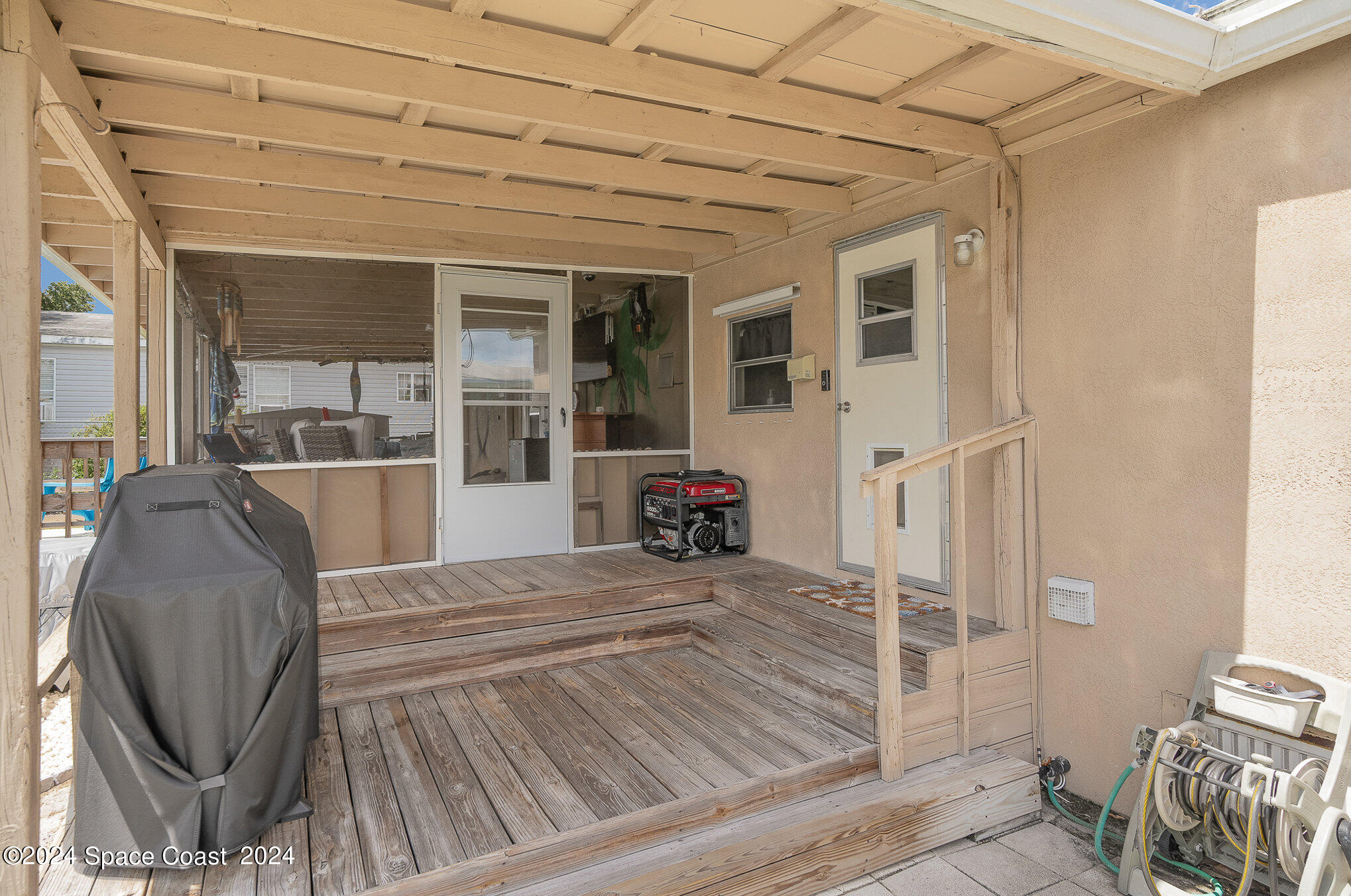 385 Ronald Street Cocoa, FL 32927 - Photo 20 of 24 a view of a livingroom with furniture and windows