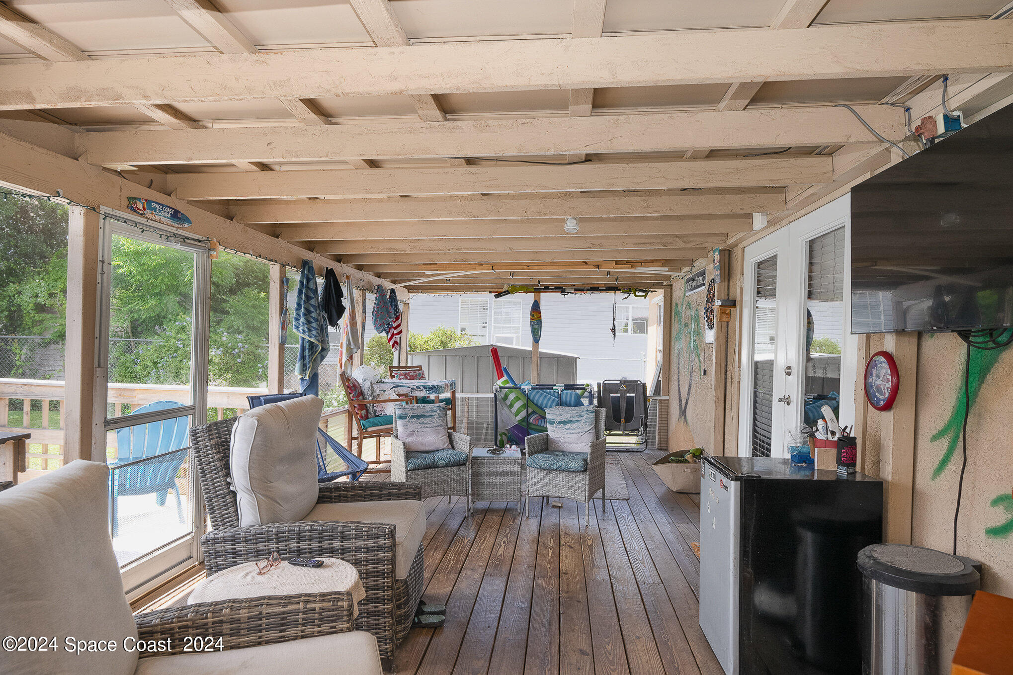 385 Ronald Street Cocoa, FL 32927 - Photo 22 of 24 a living room with furniture and wooden floor