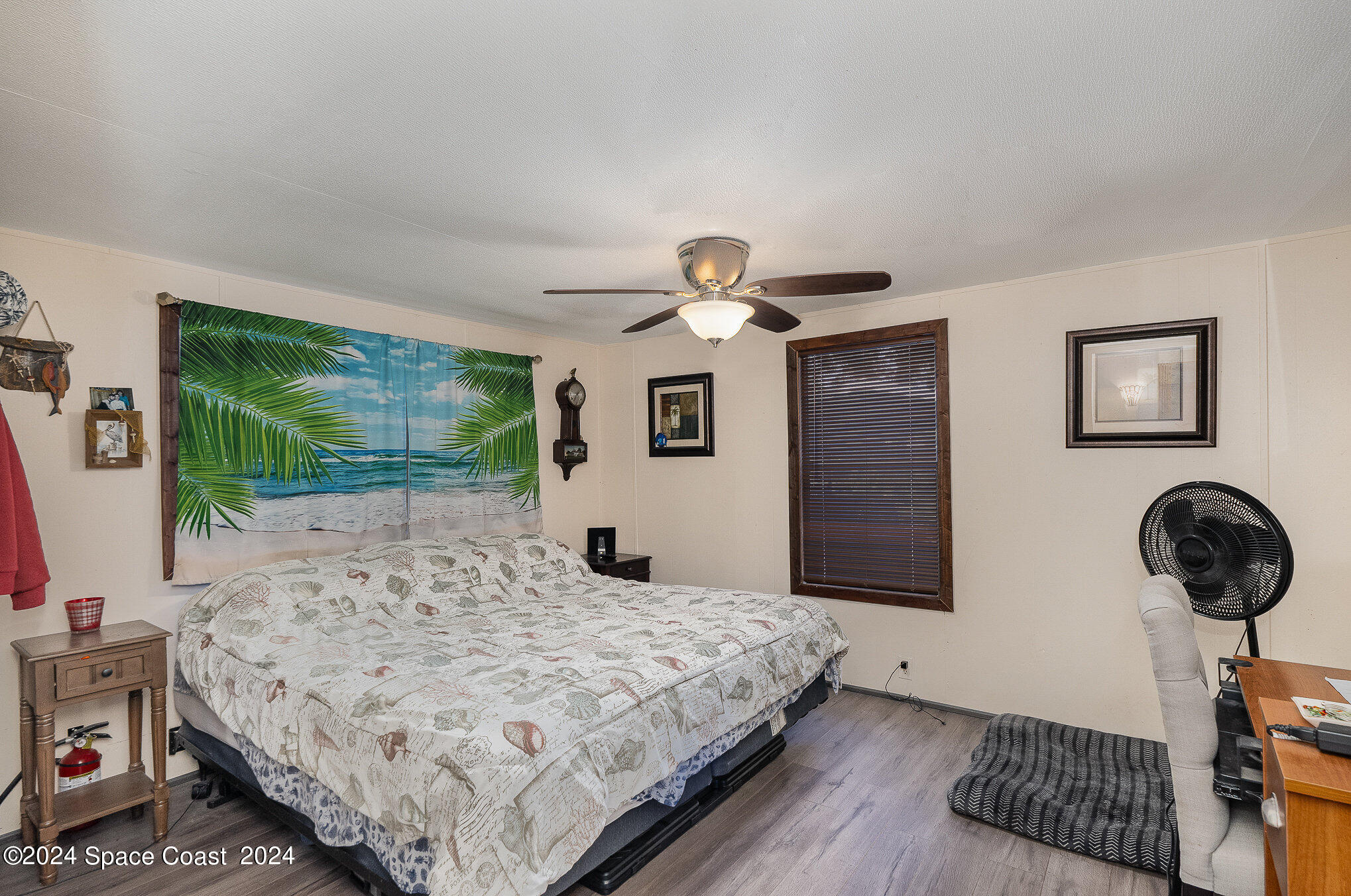 385 Ronald Street Cocoa, FL 32927 - Photo 9 of 24 a bedroom with a bed and a window