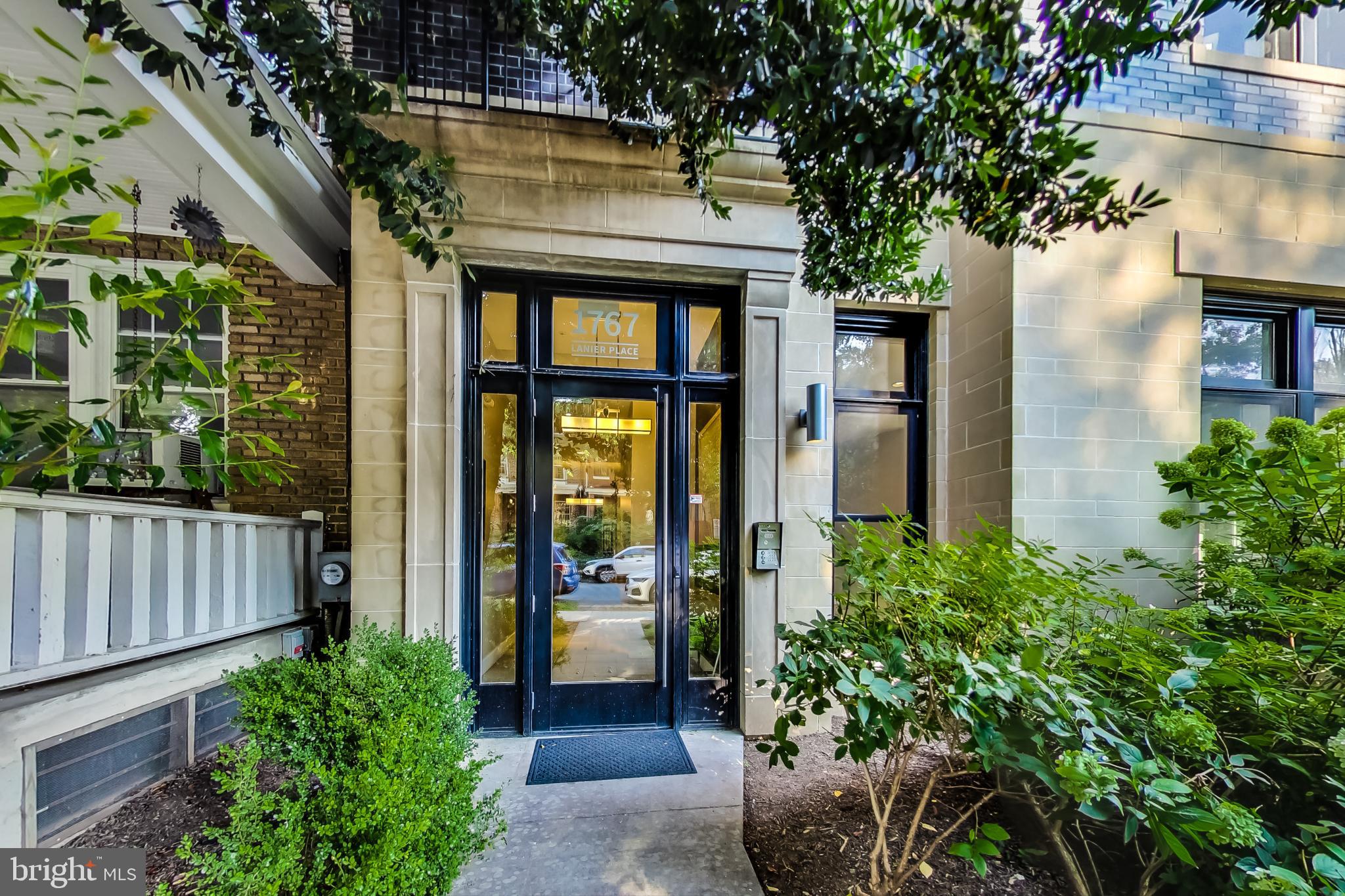 1767 Lanier Place Northwest, Unit 2 Washington, DC 20009 - Photo 14 of 19 a front view of a house with a garden