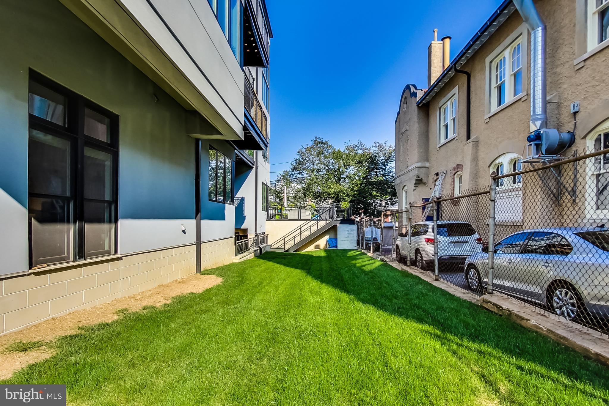 1767 Lanier Place Northwest, Unit 2 Washington, DC 20009 - Photo 17 of 19 a view of a house with a back yard