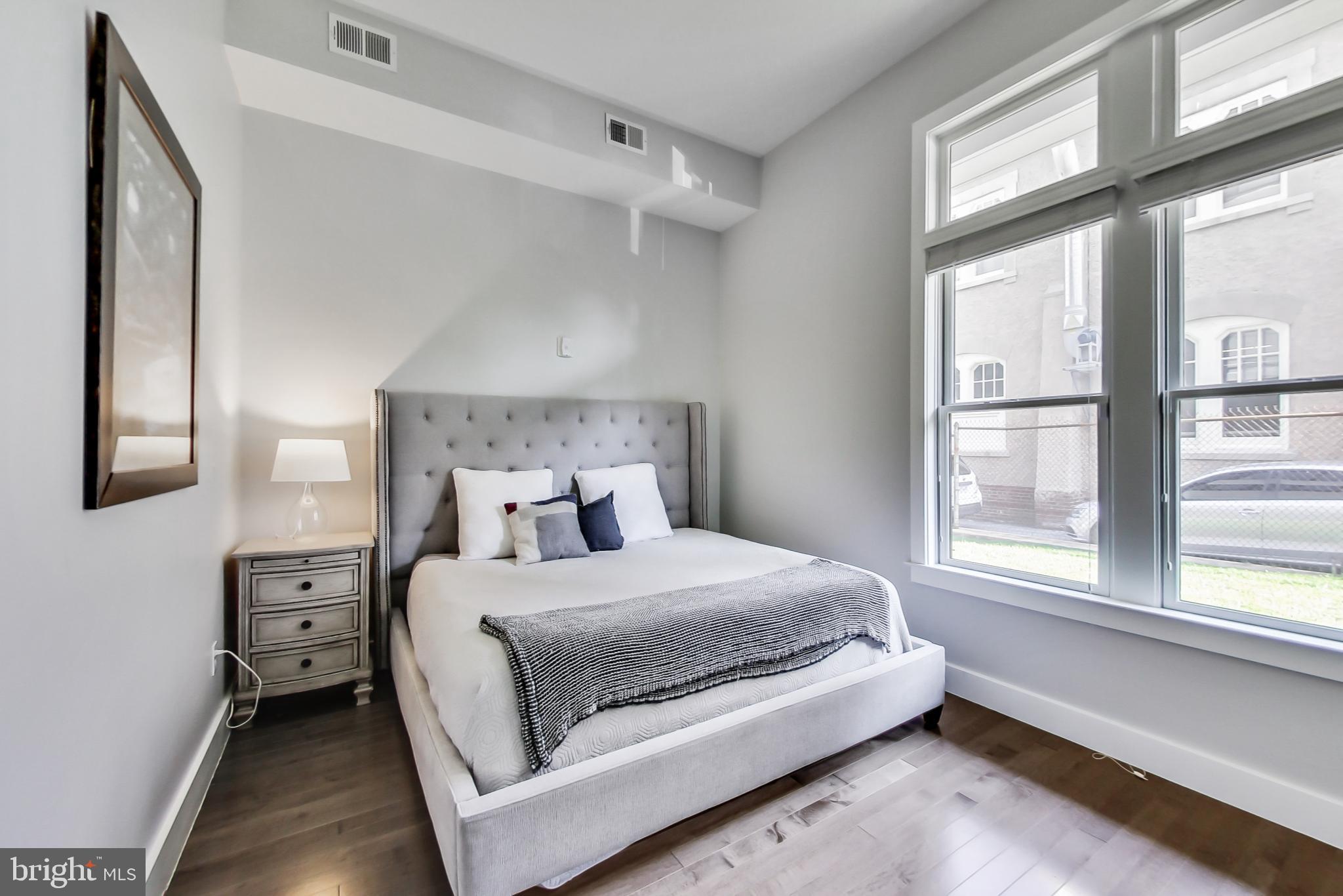 1767 Lanier Place Northwest, Unit 2 Washington, DC 20009 - Photo 6 of 19 a bedroom with a large bed and a window